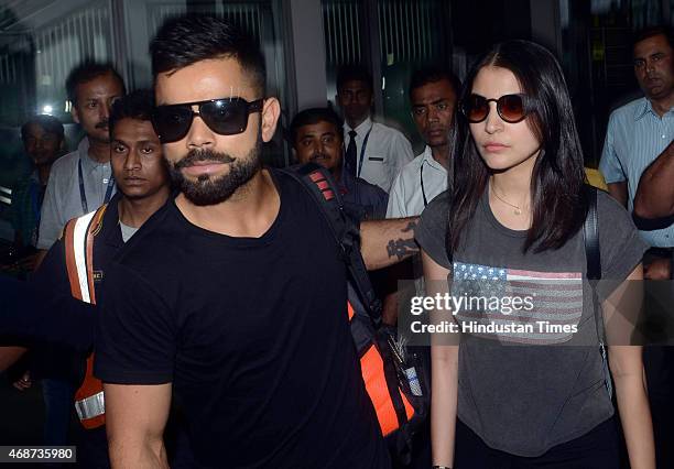 Bollywood actress Anushka Sharma and Indian cricketer Virat Kohli arrive at NSCBIA, Dum Dum Airport on April 6, 2015 in Kolkata, India. Bollywood...
