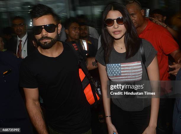 Bollywood actress Anushka Sharma and Indian cricketer Virat Kohli arrive at NSCBIA, Dum Dum Airport on April 6, 2015 in Kolkata, India. Bollywood...