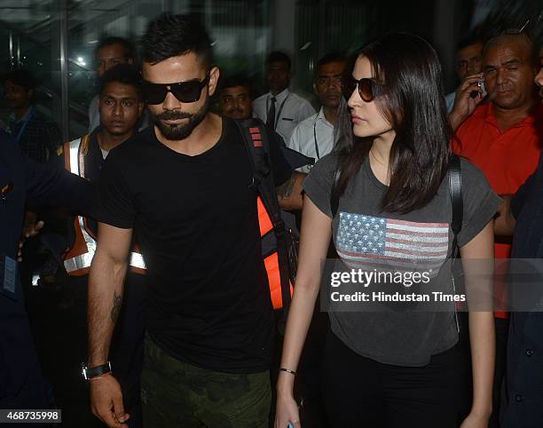 Bollywood actress Anushka Sharma and Indian cricketer Virat Kohli arrive at NSCBIA, Dum Dum Airport on April 6, 2015 in Kolkata, India. Bollywood...