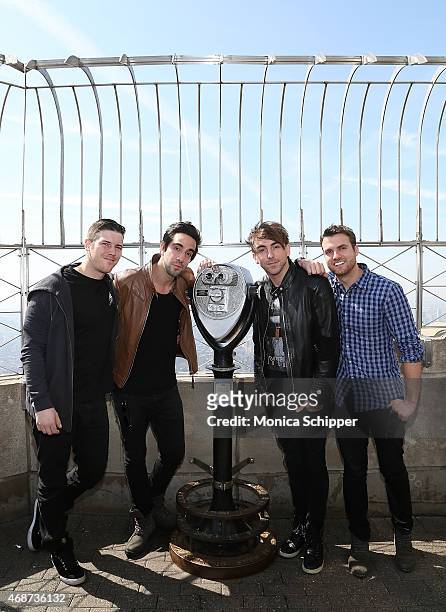 Zack Merrick, Jack Barakat, Alex Gaskarth and Rian Dawson, all of band All Time Low, visit The Empire State Building on April 6, 2015 in New York...