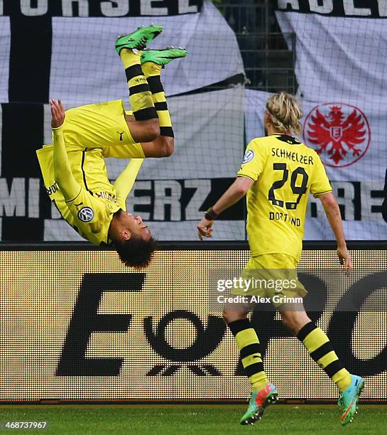 Pierre-Emerick Aubameyang of Dortmund celebrates his team's first goal with team mate Marcel Schmelzer during the DFB Cup quarterfinal match between...