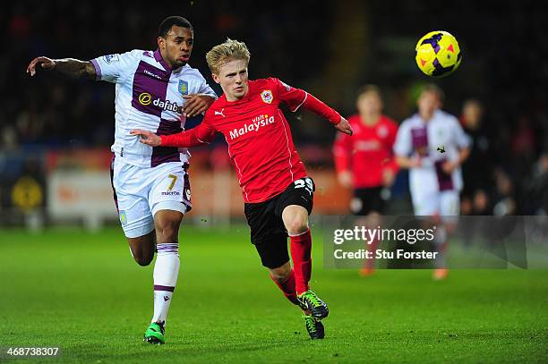 Mats Moller-Daehli of Cardiff is challenged by Leandro Bacuna of Villa during the Barclays Premier League match between Cardiff City and Aston Villa...