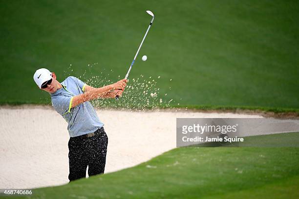 Seung-Yul Noh of Korea hits a bunker shot during a practice round prior to the start of the 2015 Masters Tournament at Augusta National Golf Club on...