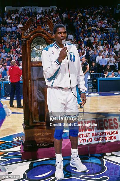 Robert Parish of the Charlotte Hornets is honored for breaking the record for all-time games played on April 6, 1996 at Charlotte Coliseum in...