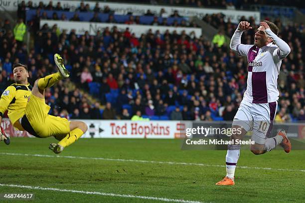 David Marshall of Cardiff City makesr a last minute save from Andreas Weimann during the Barclays Premier League match between Cardiff City and Aston...