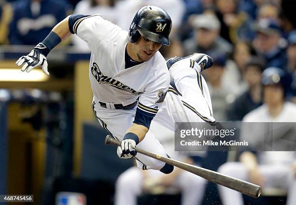 Scooter Gennett of the Milwaukee Brewers gets hit by a pitch in the second inning against the Colorado Rockies during Opening Day at Miller Park on...