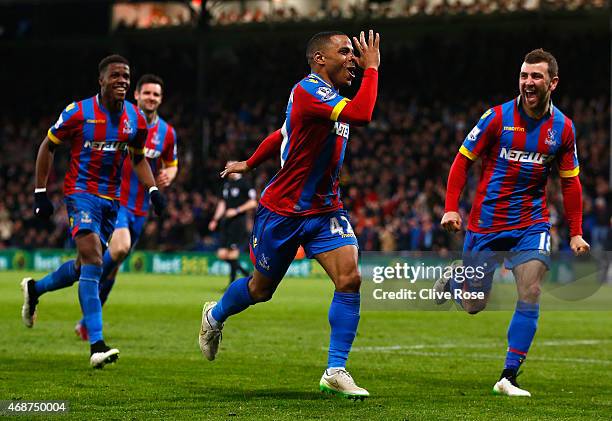 Jason Puncheon of Crystal Palace celebrates scoring his team's second goal with team mates during the Barclays Premier League match between Crystal...