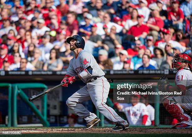 Dustin Pedroia of the Boston Red Sox hits a solo home run during the fifth inning against the Philadelphia Phillies in Philadelphia, Pennsylvania on...