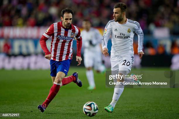 Jese Rodriguez of Real Madrid CF competes for the ball with Juan Francisco Torres alias Juanfran of Atletico de Madrid during the Copa del Rey...