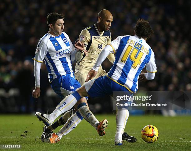 Jimmy Kebe of Leeds takes on Brighton's Stephen Ward and Inigo Calderon during the Sky Bet Championship match between Brighton & Hove Albion and...