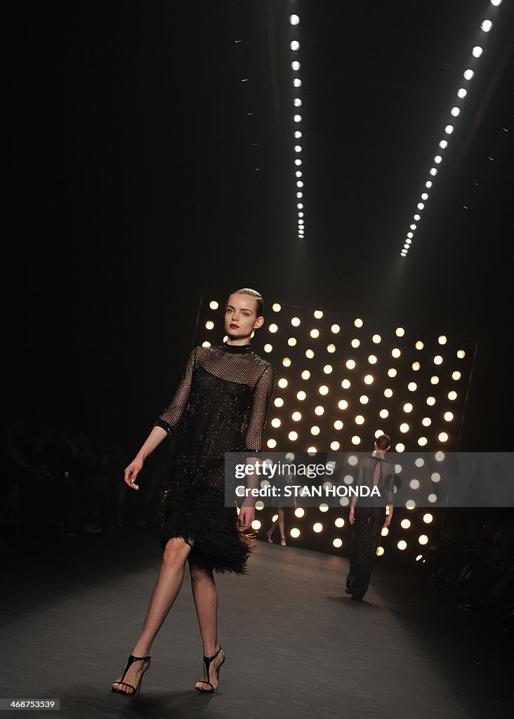 A model presents an outfit by Naeem Khan during the Mercedes-Benz ...
