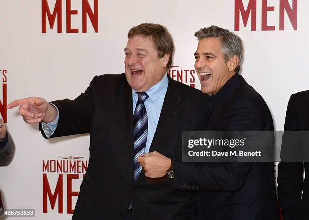 John Goodman and George Clooney attend the UK Premiere of "The Monuments Men" at Odeon Leicester Square on February 11, 2014 in London, England.