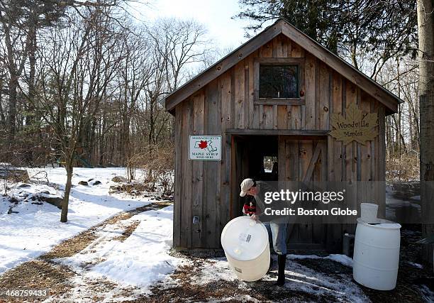 Sean Davan, owner of Woodville Maples in Hopkinton, works at his sugar house getting ready for maple sugaring season. The International Maple Syrup...