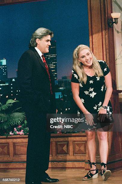 Episode 945 -- Pictured: Host Jay Leno greets swimmer Susie Maroney as she delivers the headlines on June 17, 1996 --