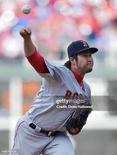 Junichi Tazawa of the Boston Red Sox pitches in the eighth inning against the Philadelphia Phillies during Opening Day at Citizens Bank Park on April...