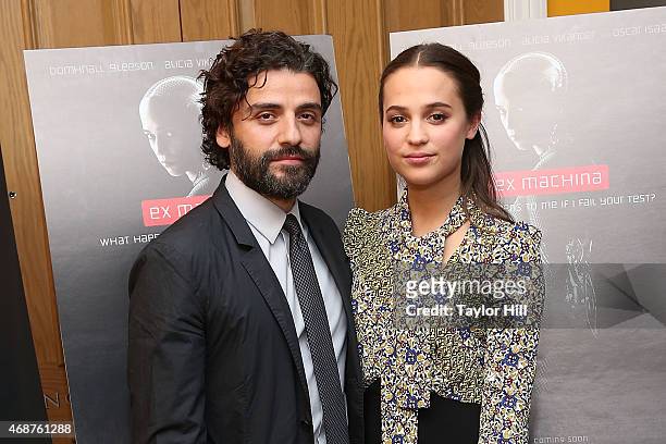 Actors Oscar Isaac and Alicia Vikander attend the "Ex Machina" New York premiere at Crosby Street Hotel on April 6, 2015 in New York City.