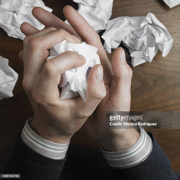 man's hands crumble writing paper - crumpled fotografías e imágenes de stock