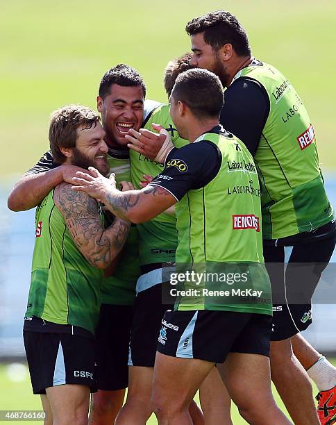 Andrew Fifita and Nathan Gardner celebrate with their team mates during a Cronulla Sharks NRL training session at Remondis Stadium on April 7, 2015...