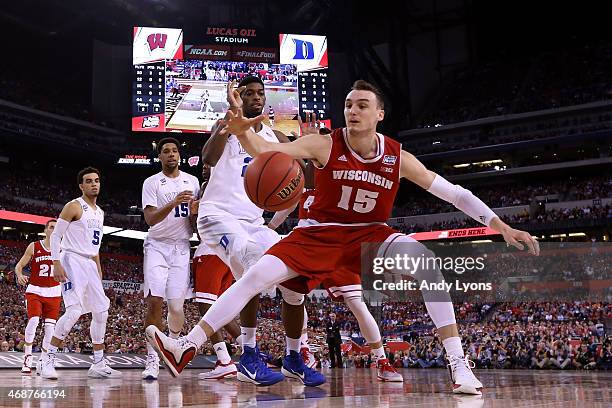 Sam Dekker of the Wisconsin Badgers goes for a loose ball against Amile Jefferson of the Duke Blue Devils in the first half during the NCAA Men's...