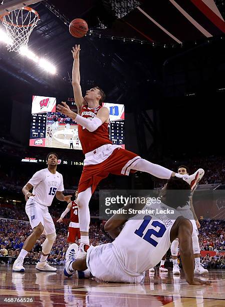 Sam Dekker of the Wisconsin Badgers drives to the basket against Justise Winslow of the Duke Blue Devils in the second half during the NCAA Men's...