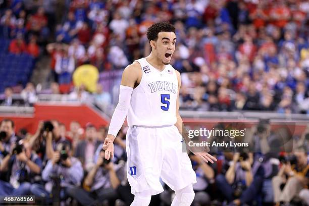 Tyus Jones of the Duke Blue Devils reacts after a three point basket late in the second half against the Wisconsin Badgers during the NCAA Men's...