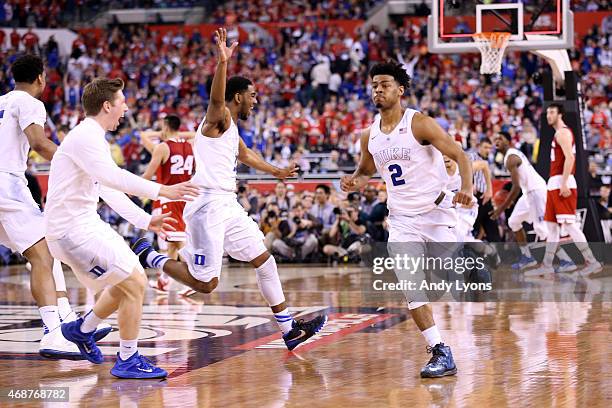 Quinn Cook of the Duke Blue Devils celebrates with teammates after defeating the Wisconsin Badgers during the NCAA Men's Final Four National...