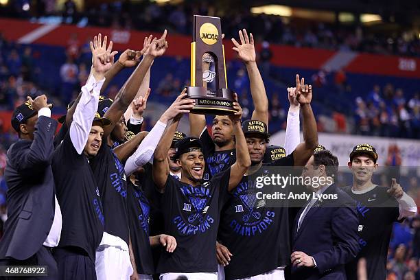 The Duke Blue Devils celebrate with the championship trophy after defeating the Wisconsin Badgers during the NCAA Men's Final Four National...