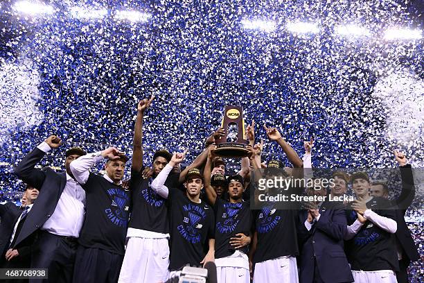 The Duke Blue Devils celebrate with the championship trophy after defeating the Wisconsin Badgers during the NCAA Men's Final Four National...