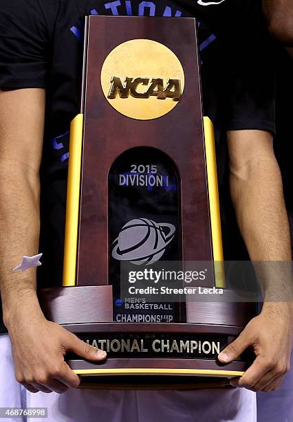 Quinn Cook of the Duke Blue Devils holds the championship trophy after defeating the Wisconsin Badgers during the NCAA Men's Final Four National...