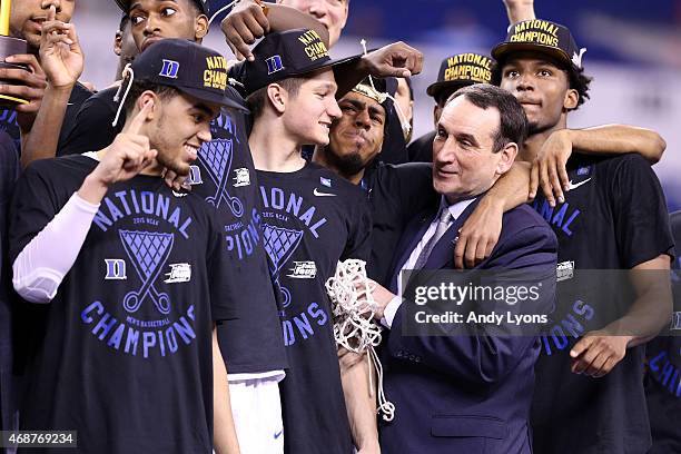 Head coach Mike Krzyzewski of the Duke Blue Devils watches "One Shining Moment" with his team after defeating the Wisconsin Badgers during the NCAA...