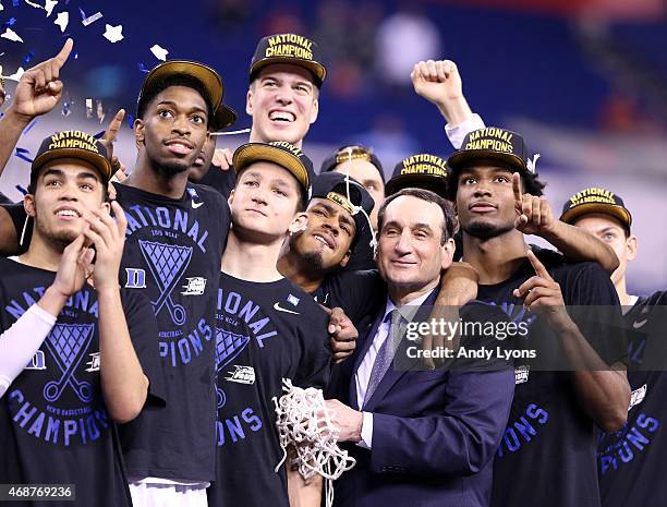 Head coach Mike Krzyzewski of the Duke Blue Devils watches "One Shining Moment" with his team after defeating the Wisconsin Badgers during the NCAA...