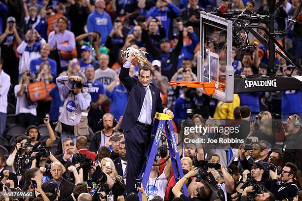 Head coach Mike Krzyzewski of the Duke Blue Devils cuts down the net after defeating the Wisconsin Badgers during the NCAA Men's Final Four National...