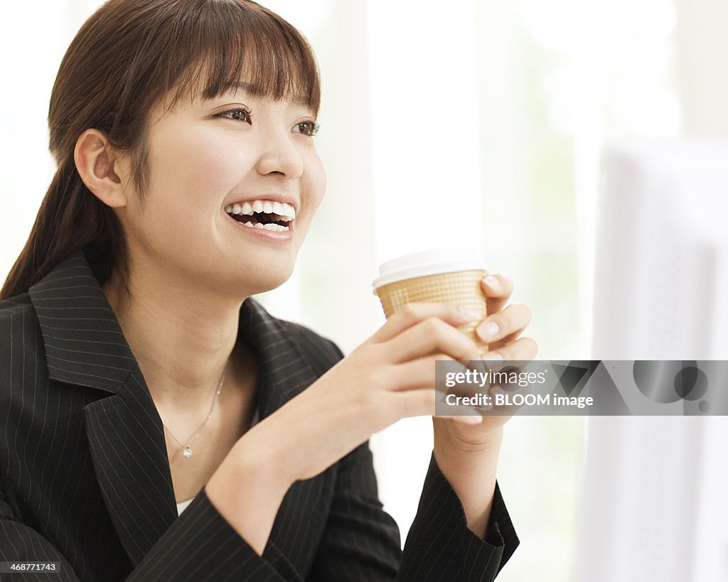 Businesswoman Holding Coffee