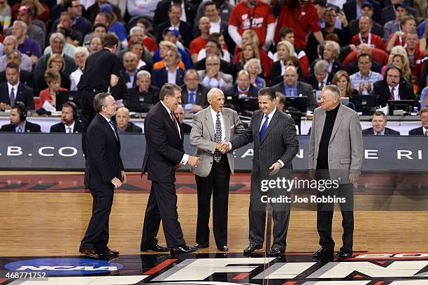 Naismith Memorial Hall of Fame President and CEO John Doleva and Jerry Colangelo shaek hands with 2015 Naismith Hall of Fame Inductees Dick Bavetta,...