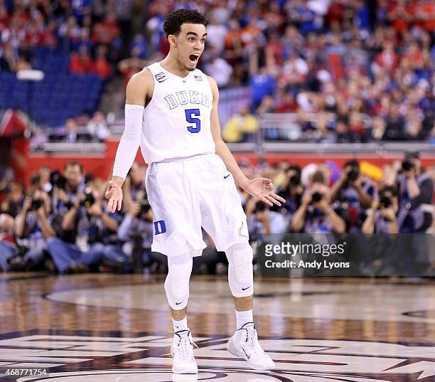 Tyus Jones of the Duke Blue Devils reacts after a three point basket late in the second half against the Wisconsin Badgers during the NCAA Men's...