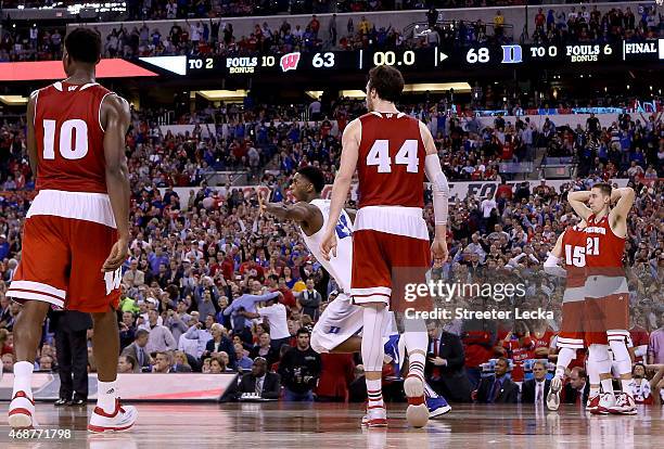 Amile Jefferson of the Duke Blue Devils celebrates with teammates after defeating the Wisconsin Badgers as Nigel Hayes, Frank Kaminsky and Bronson...