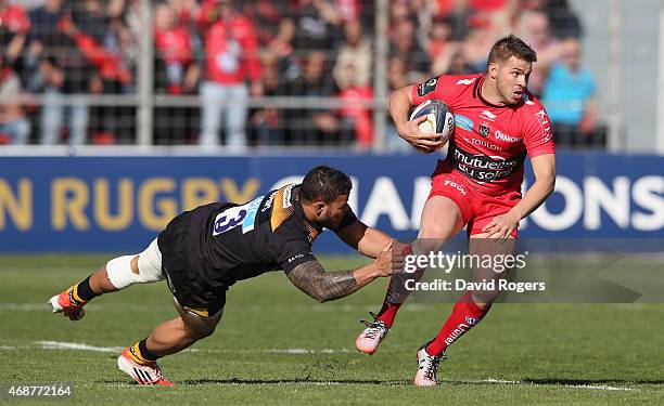 Drew Mitchell of Toulon is tackled by Alapati Leiua during the European Rugby Champions Cup quarter final match between RC Toulon and Wasps at the...