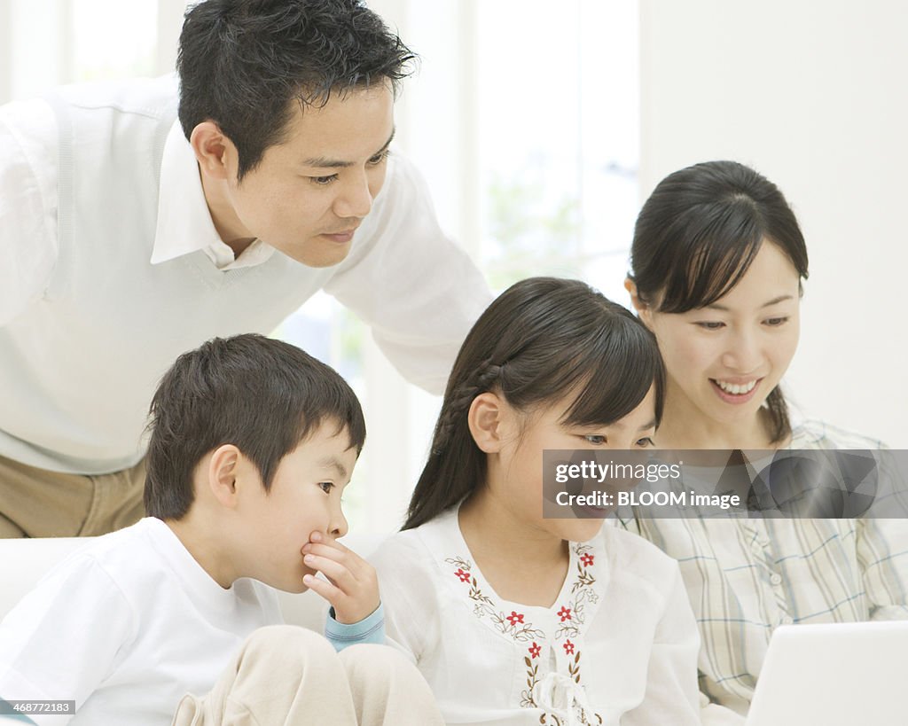 Two Generation Family Using Laptop