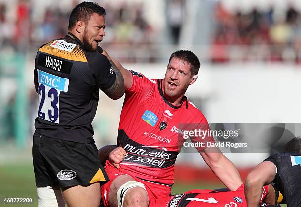 Bakkies Botha of Toulon tangles with Alapati Leiua during the European Rugby Champions Cup quarter final match between RC Toulon and Wasps at the...