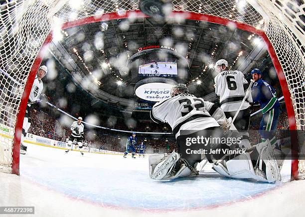 Daniel Sedin of the Vancouver Canucks scores on Jonathan Quick of the Los Angeles Kings, on the 700th career assist by Henrik Sedin of the Canucks...