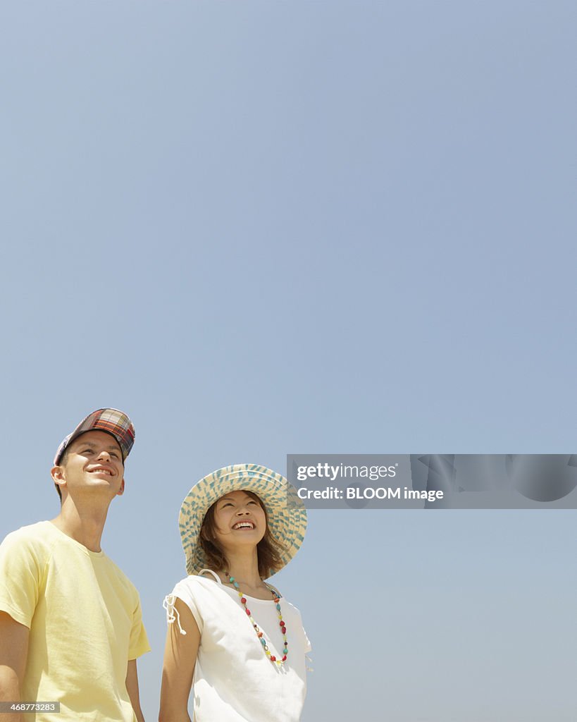 Young Couple Against Blue Sky