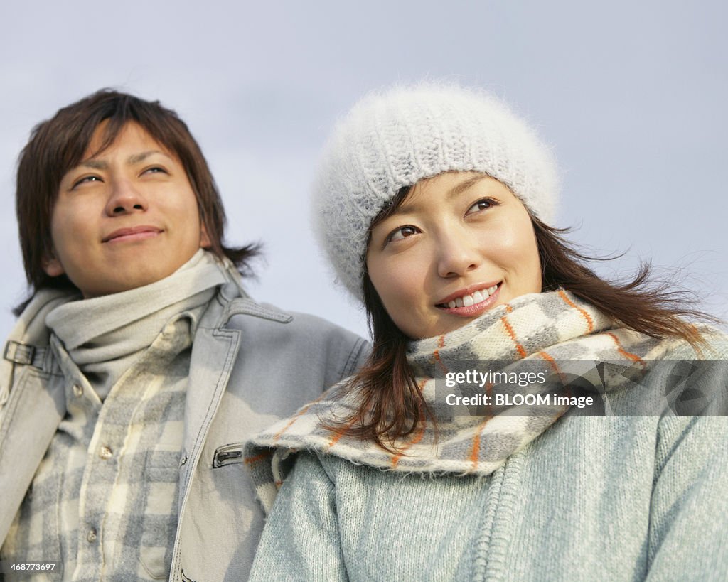 Couple Dressed In Warm Clothing