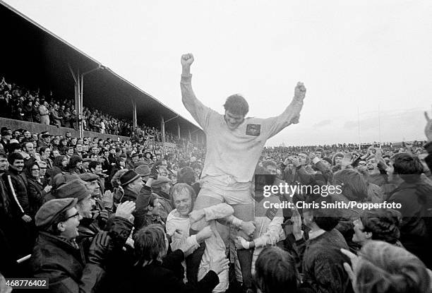 Fran Cotton is carried from the field as the North West Counties celebrate a famous victory over the New Zealand All Blacks 16-14 at Ellis Sports...