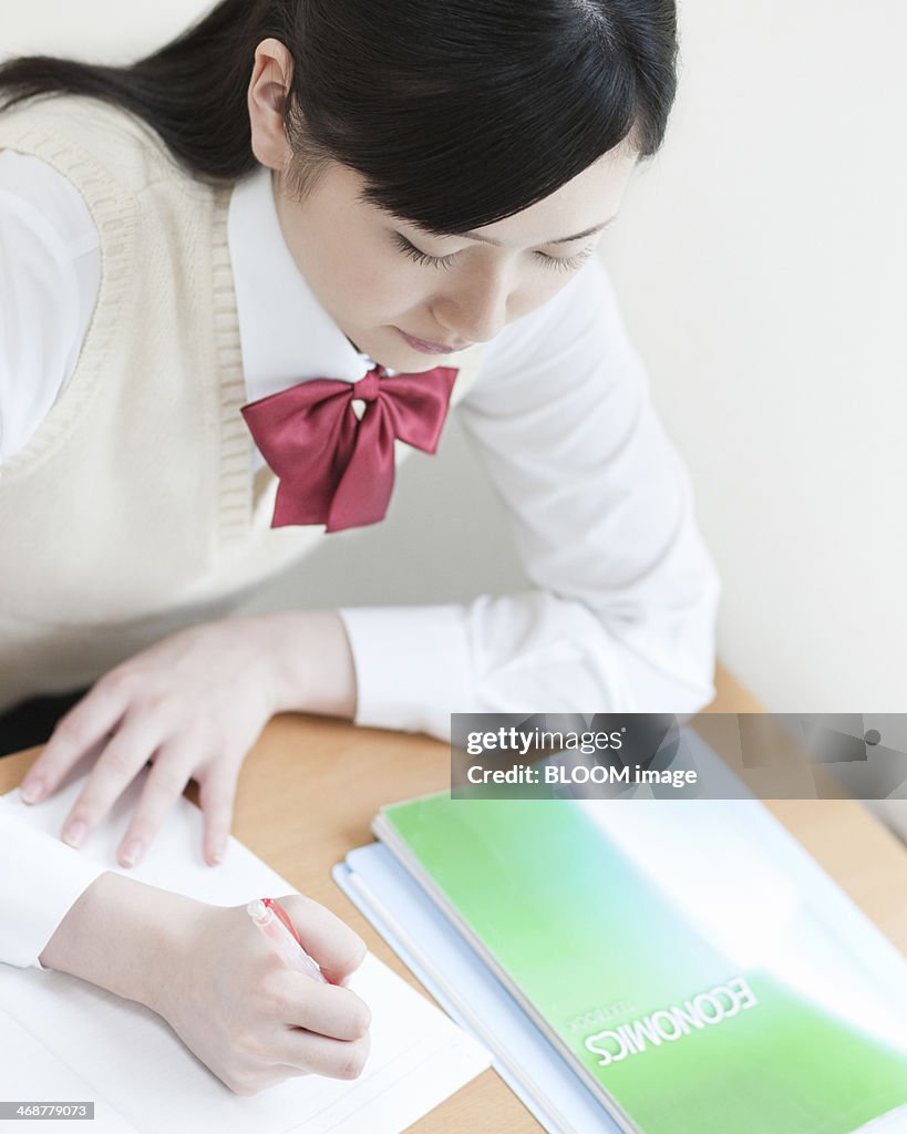 Young Female Student Doing Homework High-Res Stock Photo - Getty Images
