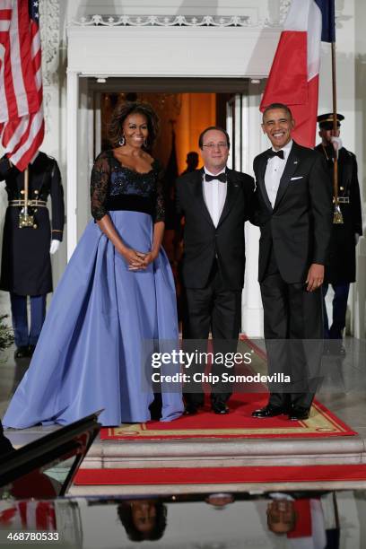 President Barack Obama and first lady Michelle Obama welcomes French President Francois Hollande during an official State Visit on the North Portico...