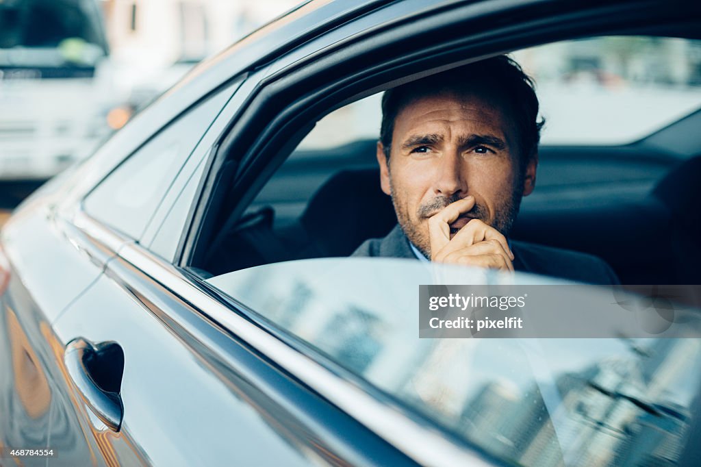 Serious businessman in a car