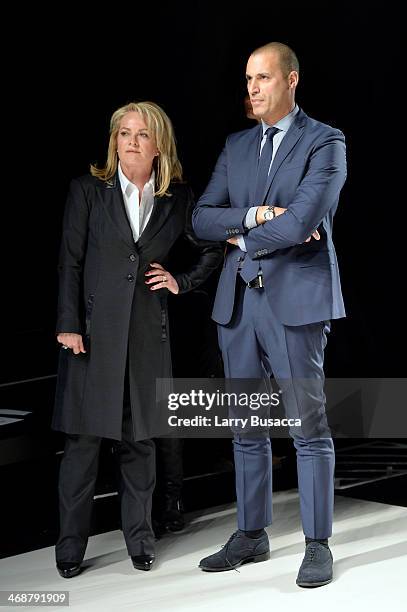 Pamella Roland and Nigel Barker observe the rehearsal before the Pamella Roland fashion show during Mercedes-Benz Fashion Week Fall 2014 at The Salon...