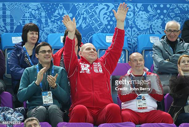 Former Russian swimmer Alexander Popov and former greco-roman wrestler Alexander Karelin and George Bryusov attend the Figure Skating Pairs Short...
