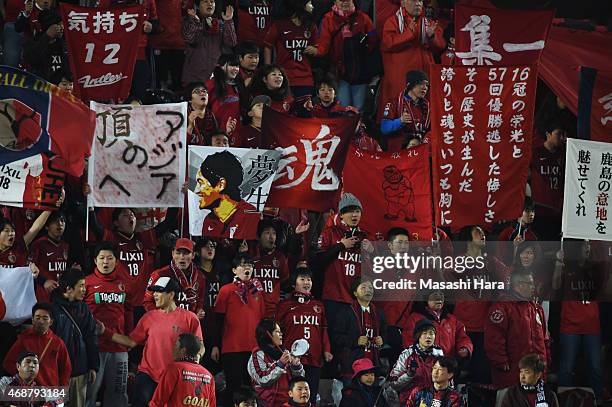 Kashima Antlers supporters cheer on their team prior to the AFC Champions League Group H match between Kashima Antlers and Guangzhou Evergrande at...