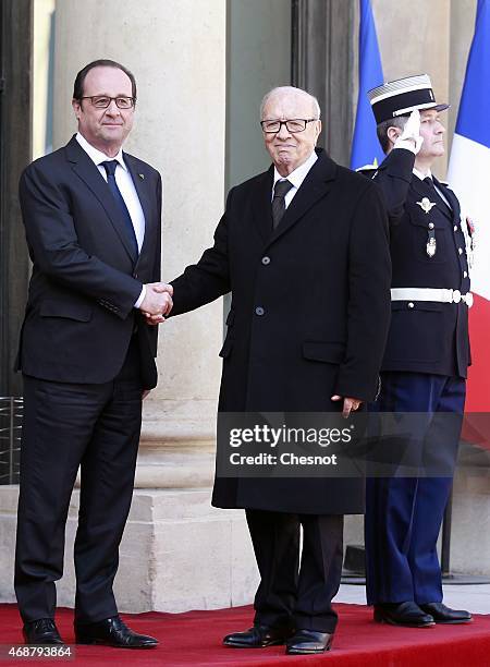 French President Francois Hollande welcomes Tunisian President Beji Caid Essebsi prior a meeting at the Elysee Palace on April 07, 2015 in Paris,...